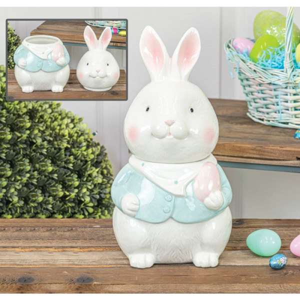 Ceramic bunny figurine in a pastel blue jacket holding a pink egg