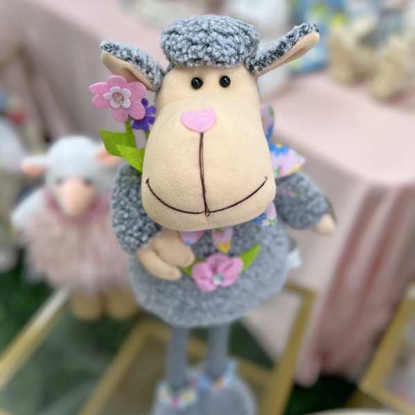 Plush sheep figurine with small felt flowers