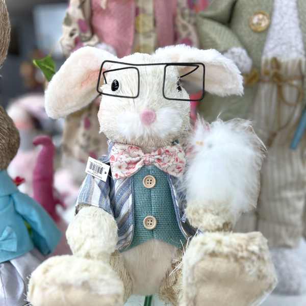 Plush bunny figurine wearing glasses and a bow tie