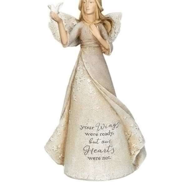 Angel figurine in a cream dress holding a white dove