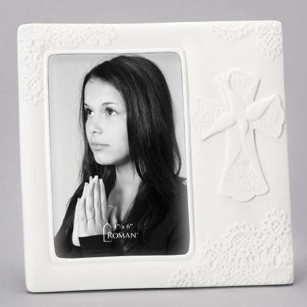White photo frame with a black-and-white portrait and angel decoration