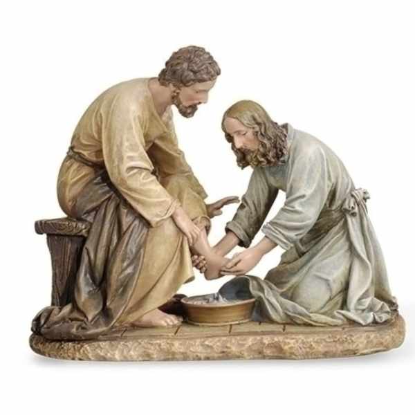 Religious figurine of two men washing feet in a basin