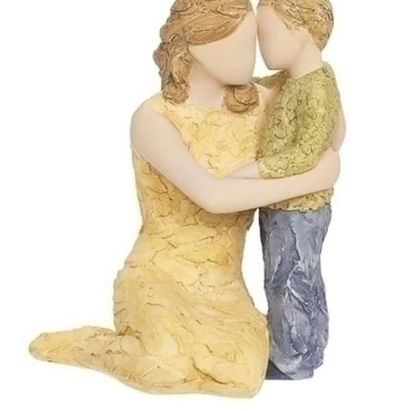 Two faceless figurines embracing, one kneeling and one standing