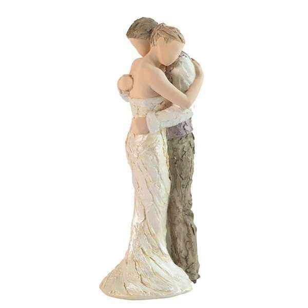 Figurine of a couple embracing in wedding attire