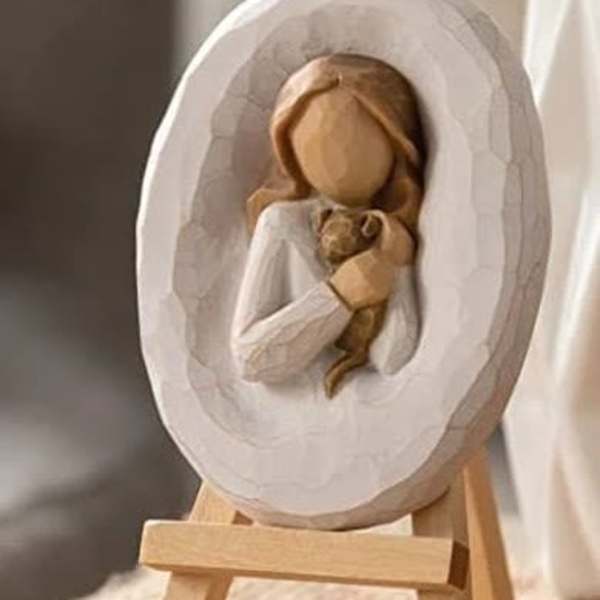 Wooden nativity figurine on a small easel