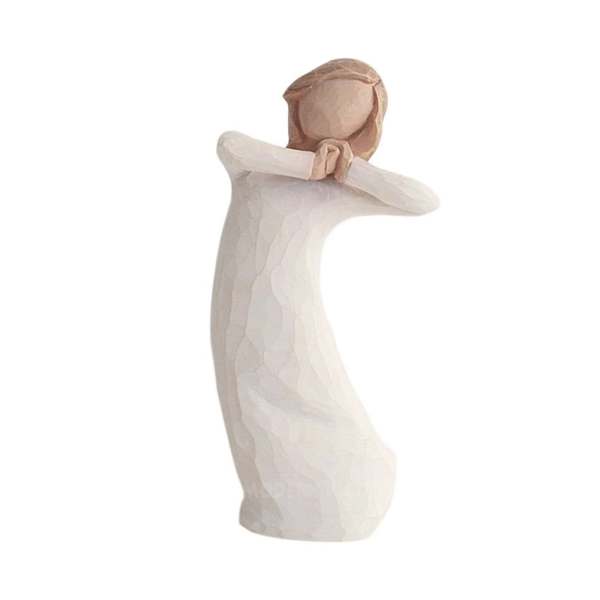 Wooden angel figurine with folded arms in white and natural wood tones