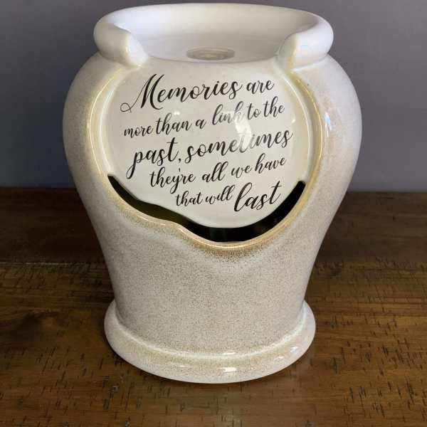 Ceramic memorial vase with a quote on the front