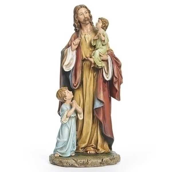 Religious statue of a man holding two children on a stone base