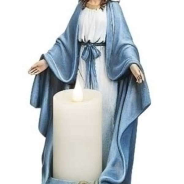 Statue of the Virgin Mary holding a large white candle