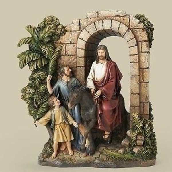 Religious figurine of Jesus with two children under a stone arch
