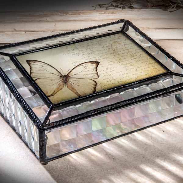 Decorative glass box with a butterfly design on the lid