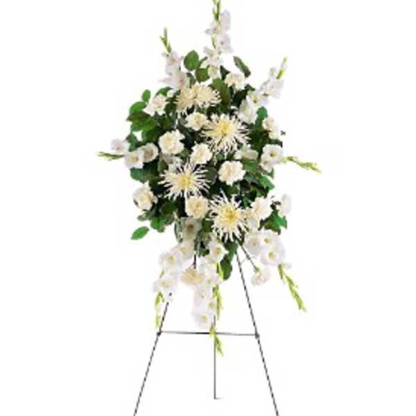 Tall white standing spray with carnations and spider mums on a metal easel