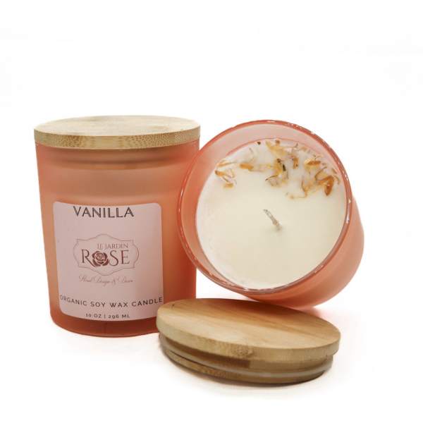 Two vanilla candles in frosted glass jars with bamboo lids