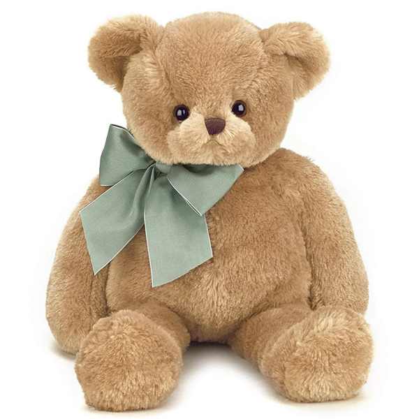 Plush teddy bear with a large ribbon bow