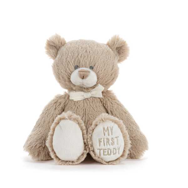 Beige teddy bear with a bow and "My First Teddy" on one paw