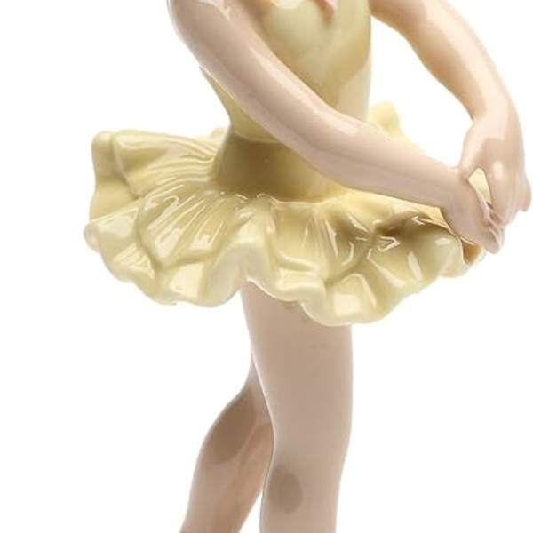 Porcelain figurine of a ballerina in a yellow tutu
