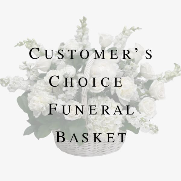 White funeral basket arrangement with roses and snapdragons