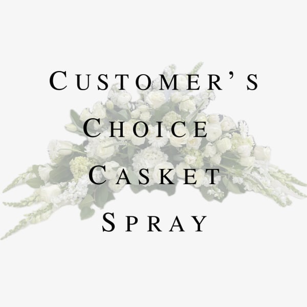 White casket spray with mixed flowers and greenery
