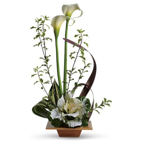 Tall white calla lilies with ornamental cabbage in a shallow square wooden container