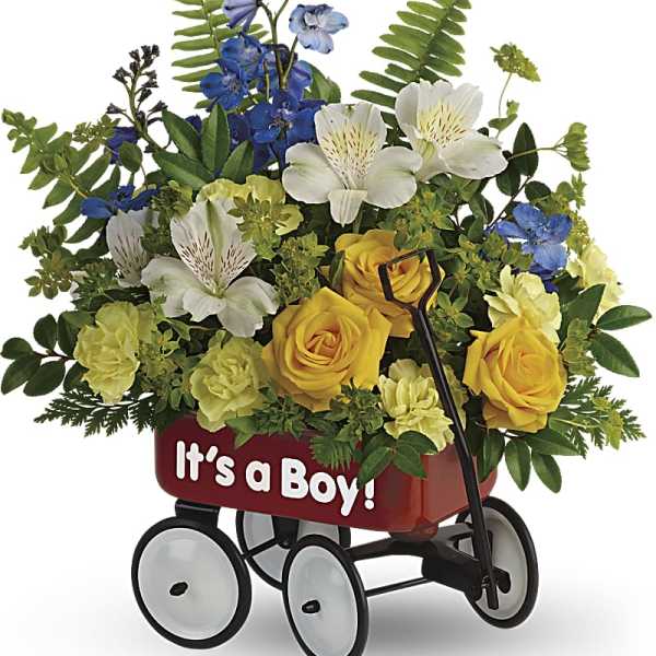 Flower arrangement in a red wagon with "It's a Boy!" text