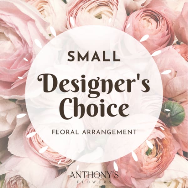 Pink ranunculus bouquet with a designer's choice label