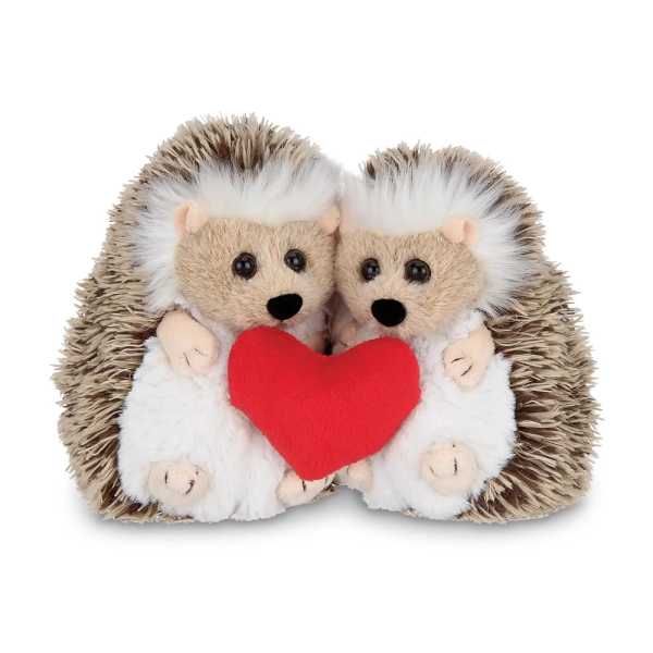 Pair of plush hedgehogs cuddling and holding a red heart