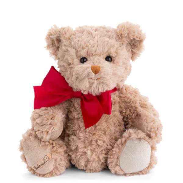 Plush teddy bear with a red ribbon bow