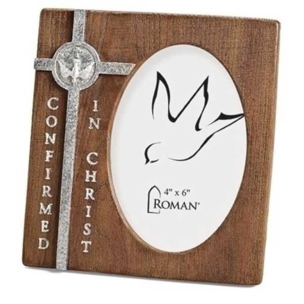 Wooden photo frame with a silver cross and dove design