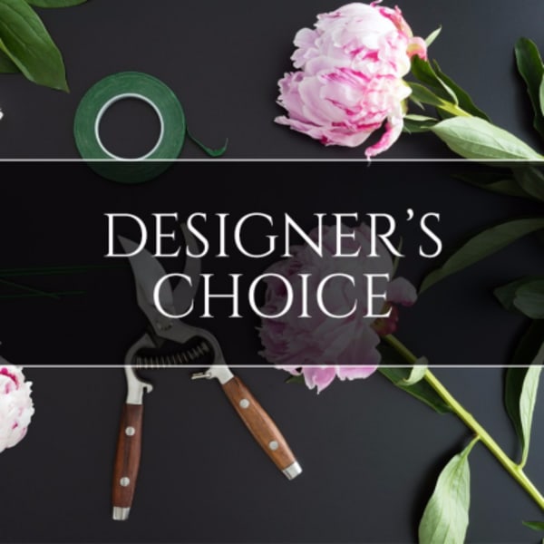 Flat lay of pink peonies with floral tools and text reading Designer's Choice