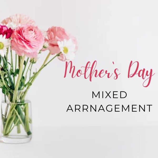 Pink mixed flowers in a clear glass vase with Mother's Day text
