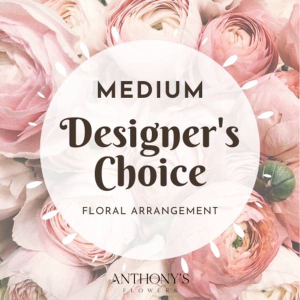 Pink ranunculus floral arrangement with a "Medium Designer's Choice" label