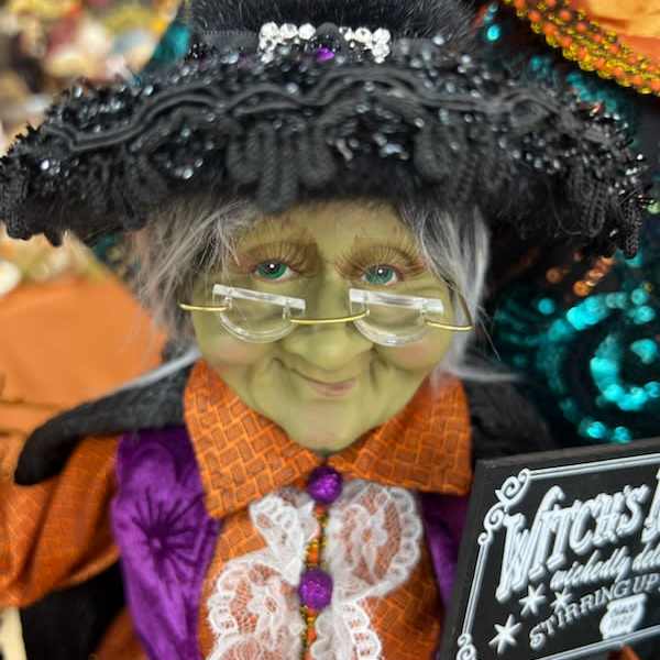 Decorative witch figurine with glasses and black hat