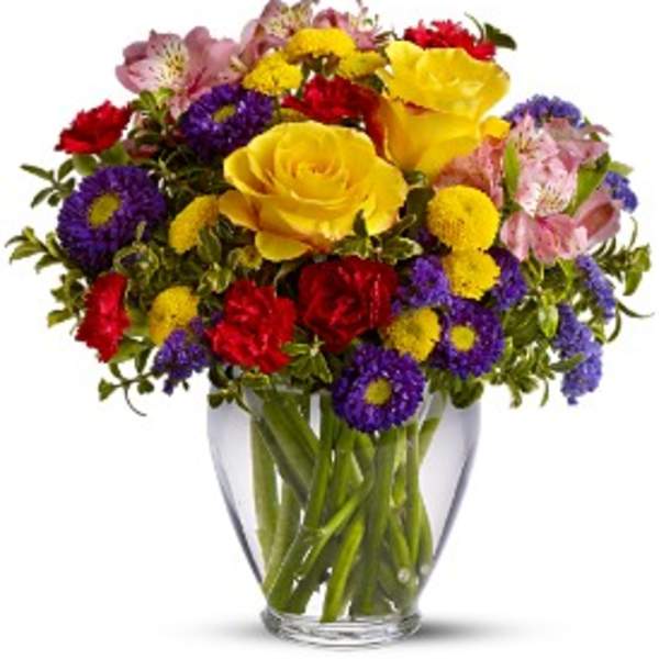 Colorful mixed bouquet in a clear glass vase