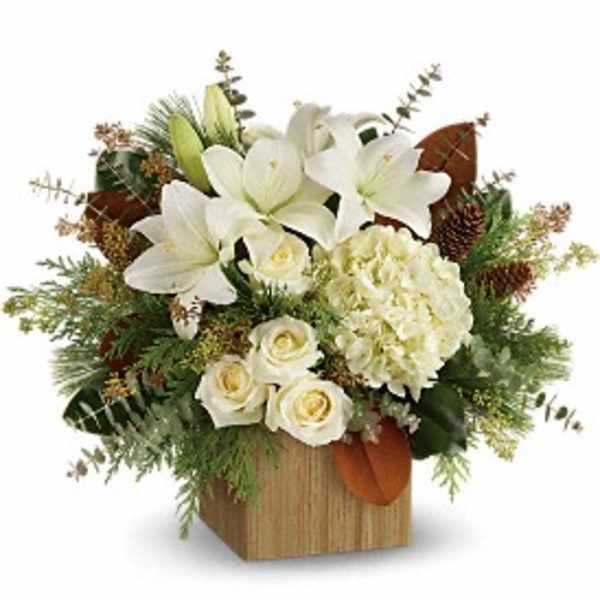 White lilies and roses in a wooden box arrangement