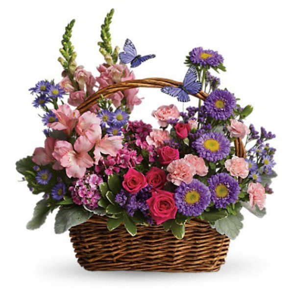 Basket arrangement of pink and purple flowers with butterfly accents