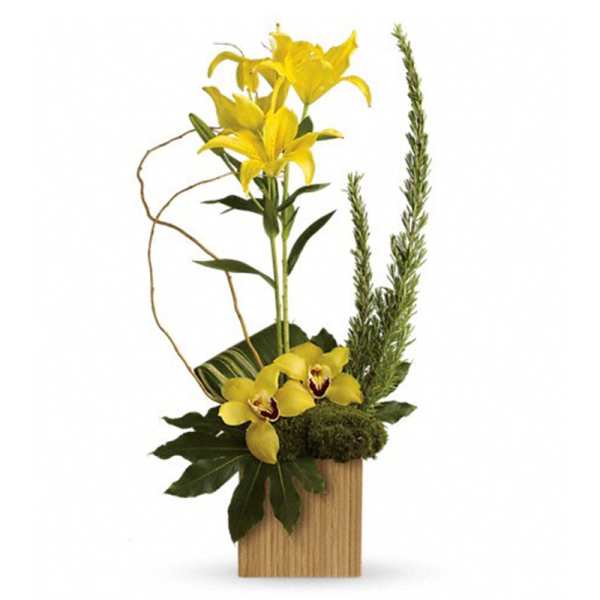Tall modern arrangement of yellow lilies and orchids in a rectangular wood container