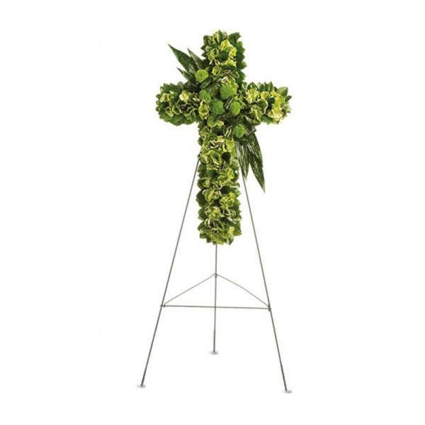 Standing cross of green flowers on a tall metal easel