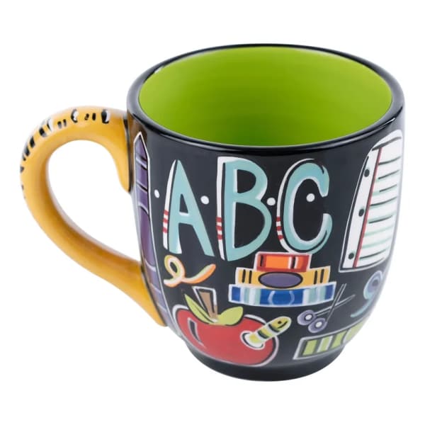 Colorful ABC-themed ceramic mug with a yellow handle