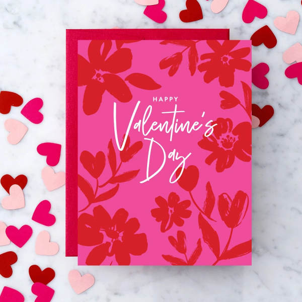 Pink Valentine’s Day greeting card with floral hearts and a red envelope
