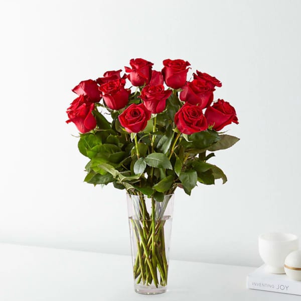 Bouquet of red roses in a clear glass vase