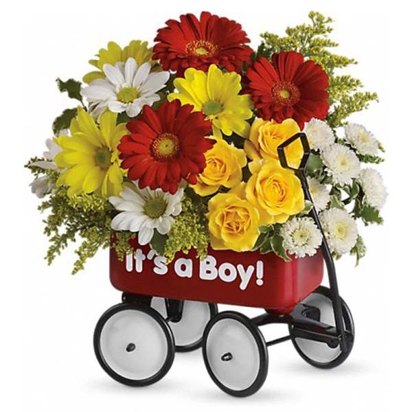 Flower arrangement in a red wagon with "It's a Boy!" text