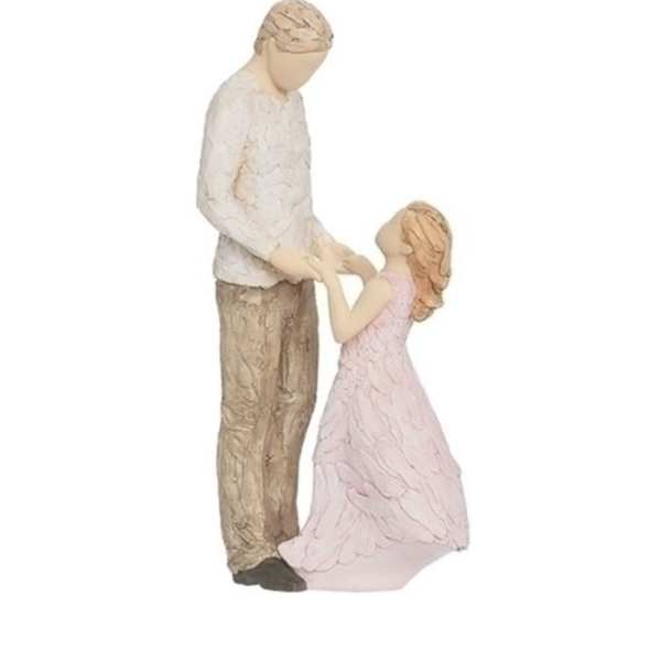 Figurine of a man and girl holding hands