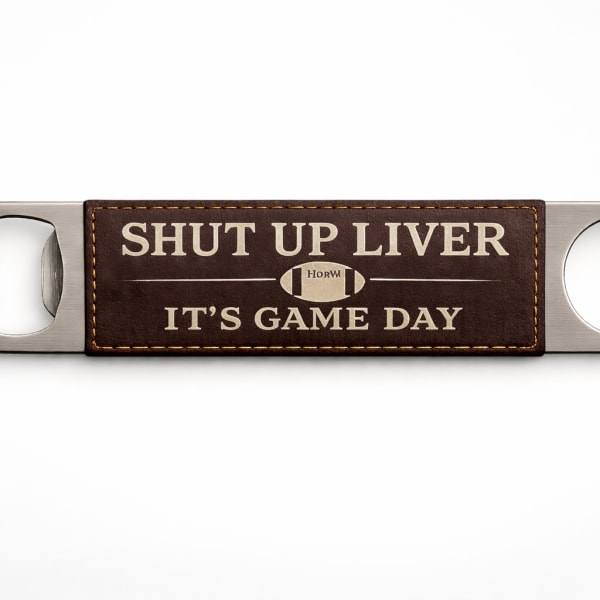 Metal bottle opener with a leather patch reading "SHUT UP LIVER IT'S GAME DAY"