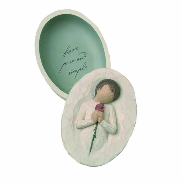 Oval plaque with a carved figure holding a flower