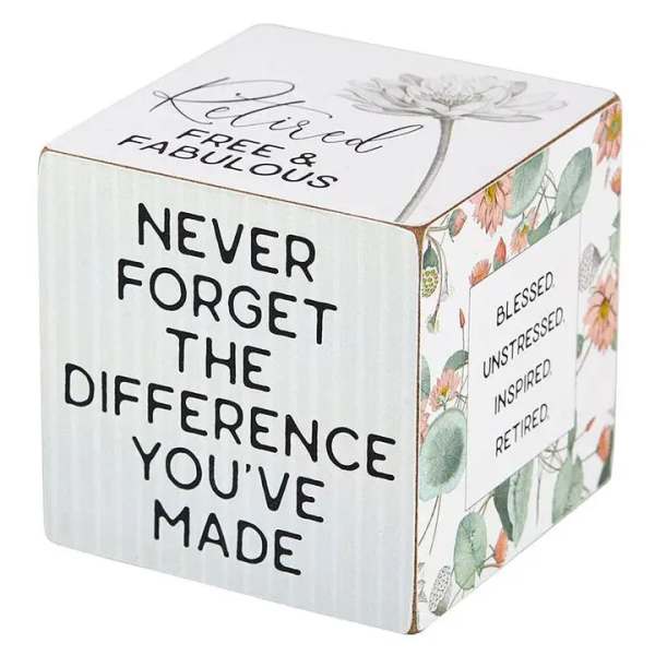 Decorative cube with retirement message and floral accents
