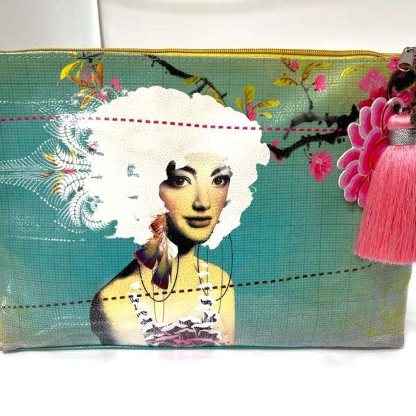 Decorative zip pouch with a woman illustration and pink tassel charm