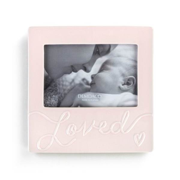 Pink photo frame with a baby picture and the word Loved