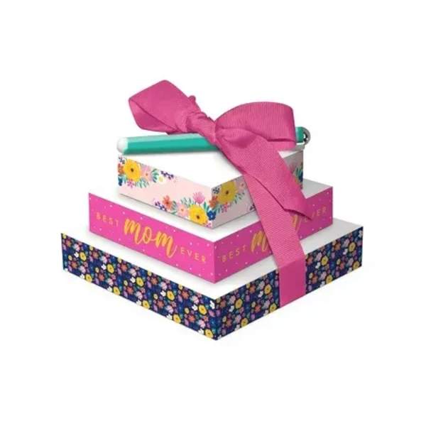 Stacked gift boxes tied with a pink ribbon and a pen on top
