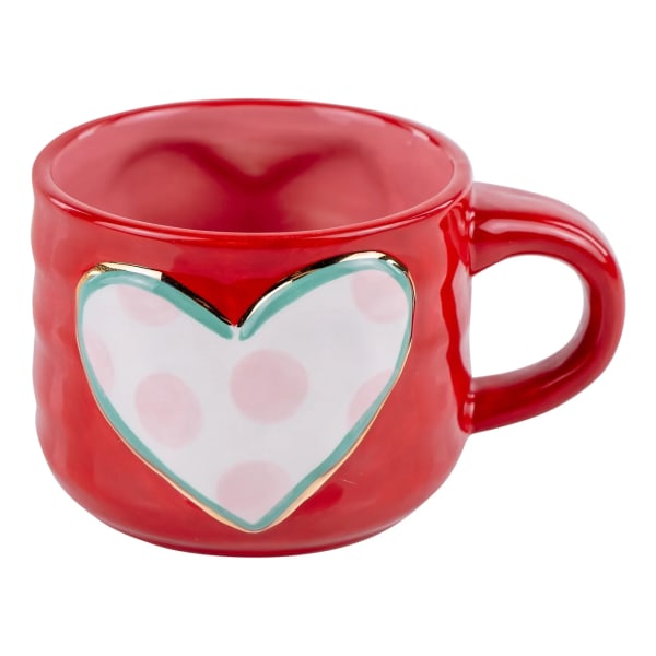 Red ceramic mug with a heart design on the front