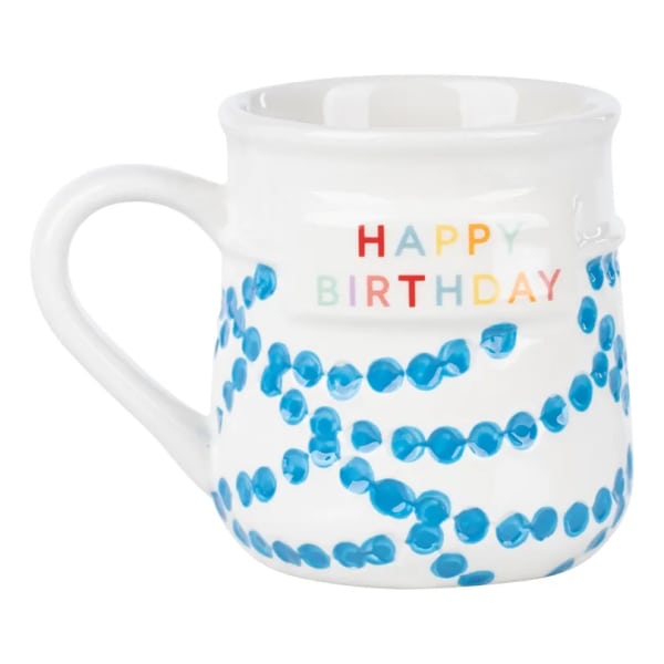 White ceramic mug with colorful "Happy Birthday" text and blue confetti dots